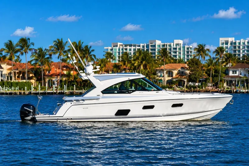 The Image of 2020 Formula 400 Super Sport Crossover yacht cruising on a sunny waterfront. - 0
