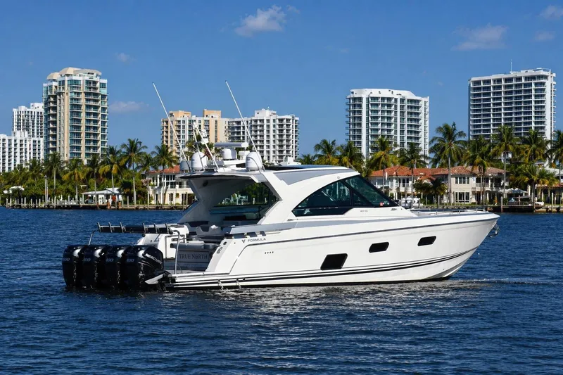 Slide: The Image of 2020 Formula 400 Super Sport Crossover yacht cruising near urban waterfront skyline. - 1