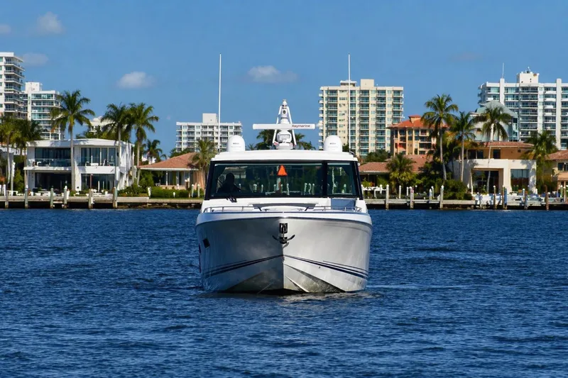 Slide: The Image of 2020 Formula 400 Super Sport Crossover yacht cruising near waterfront cityscape. - 6
