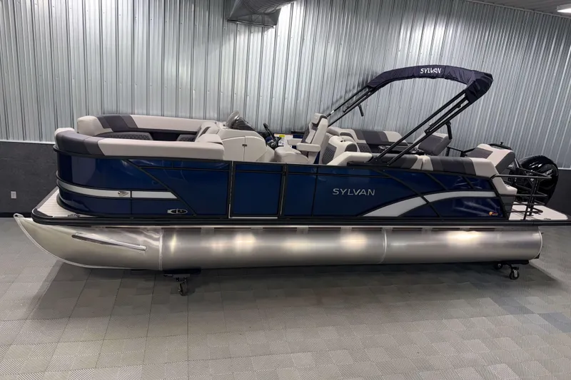 The Image of 2026 Sylvan L3 SLZ pontoon boat in showroom, featuring sleek blue design and comfortable seating. - 0