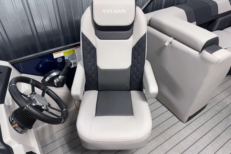 Slide: The Image of 2026 Sylvan L3 SLZ boat interior with steering wheel and captain's chair. - 10