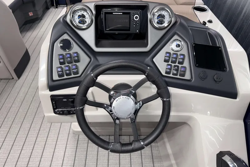Slide: The Image of 2026 Sylvan L3 SLZ boat dashboard with steering wheel and control panel. - 11