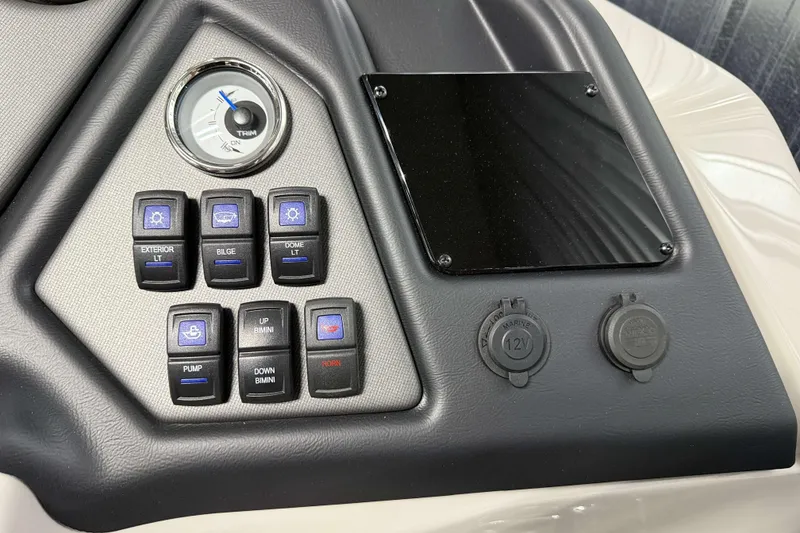 Slide: The Image of Control panel of 2026 Sylvan L3 SLZ boat with switches and gauges. - 14