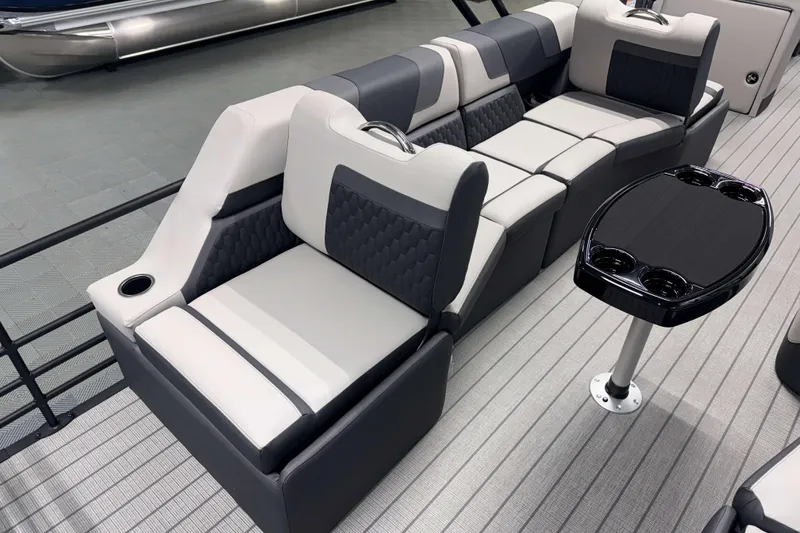 Slide: The Image of Luxurious seating on 2026 Sylvan L3 SLZ pontoon boat with modern design and cup holders. - 21
