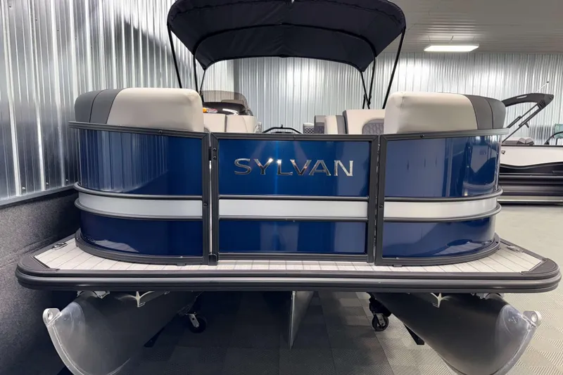 Slide: The Image of 2026 Sylvan L3 SLZ pontoon boat with blue exterior in showroom. - 27