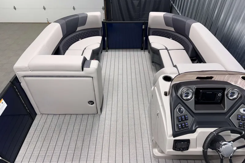 Slide: The Image of 2026 Sylvan L3 SLZ pontoon boat interior with plush seating and modern helm controls. - 5