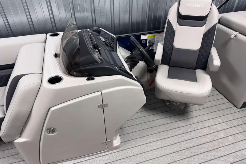 Slide: The Image of 2026 Sylvan L3 SLZ boat interior with steering console and captain's chair. - 8
