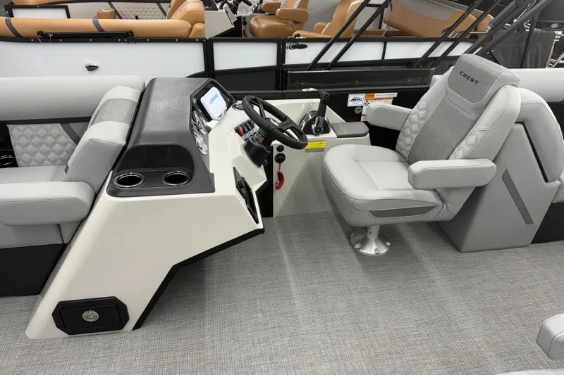 Slide: The Image of Interior of 2026 Crest Conquest 215 SLC boat with modern helm and seating. - 5