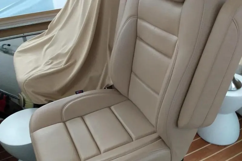 Slide: The Image of Beige leather seat on 1989 Chris-Craft 381 Catalina boat interior. - 9
