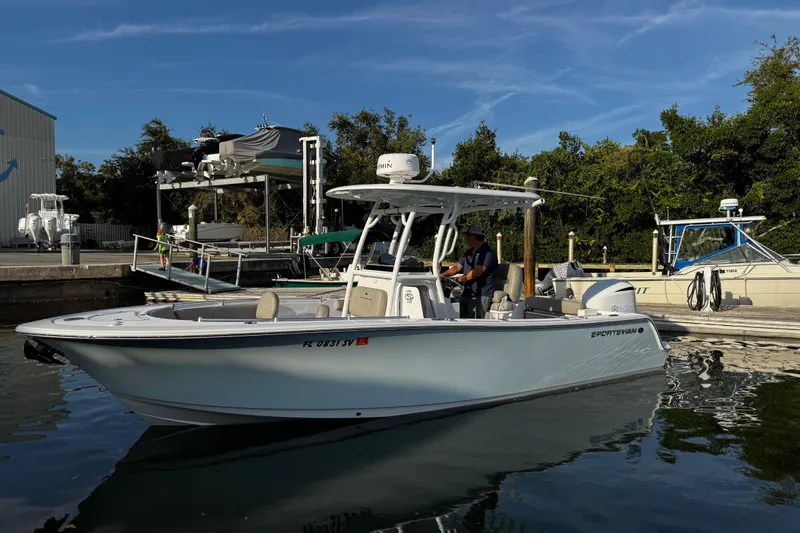 Slide: The Image of 2021 Sportsman Open 242 Center Console boat docked at marina. - 11