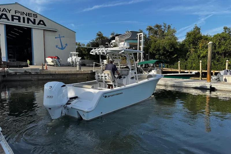 Slide: The Image of 2021 Sportsman Open 242 Center Console boat at marina dock. - 2