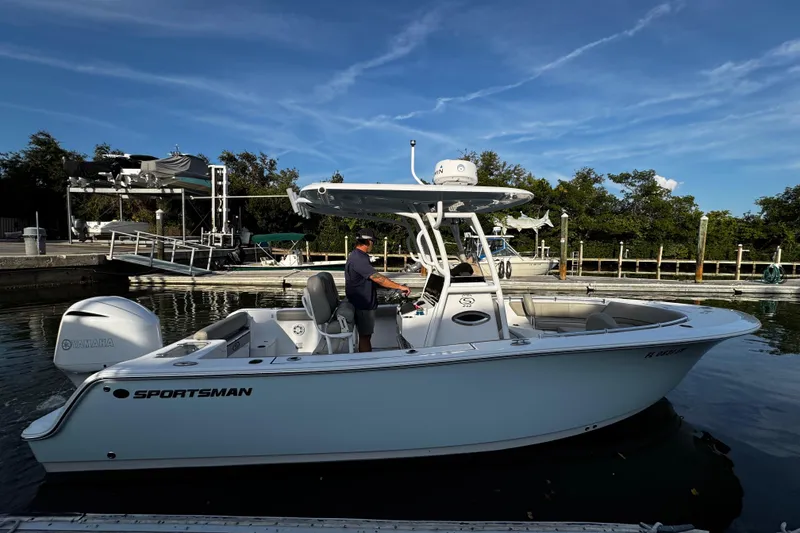 Slide: The Image of 2021 Sportsman Open 242 Center Console boat docked at marina. - 20