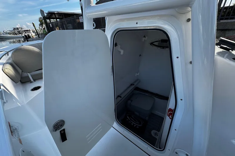 Slide: The Image of 2021 Sportsman Open 242 Center Console boat with open storage compartment. - 32