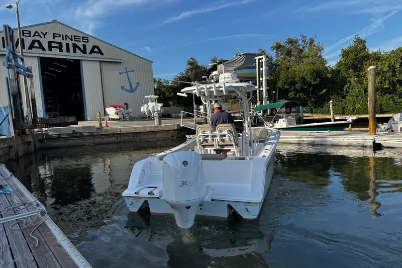 Slide: The Image of 2021 Sportsman Open 242 Center Console boat at Bay Pines Marina dock. - 4