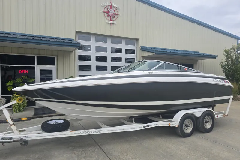 The Image of 2001 Cobalt 232 boat on trailer outside Lake Viking Marine building. - 0