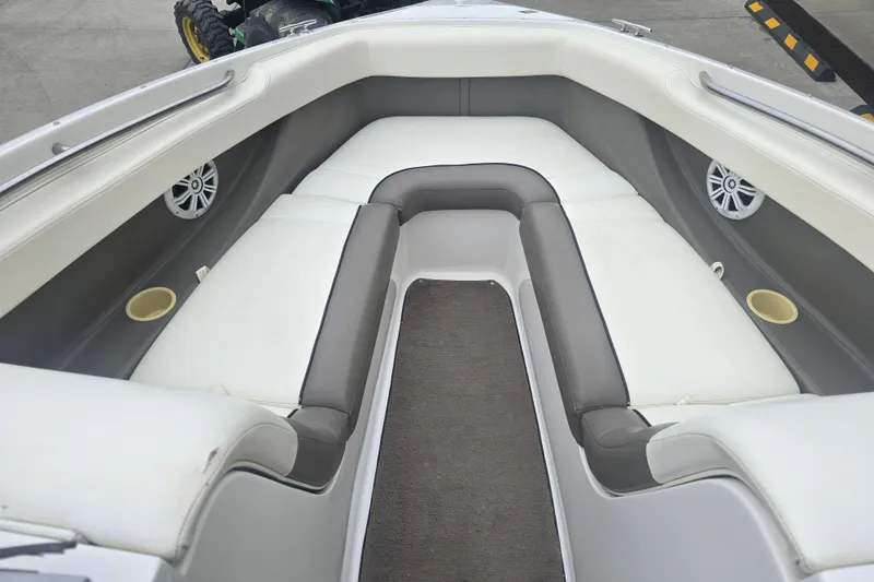Slide: The Image of Interior of a 2001 Cobalt 232 boat with white and gray seating. - 11