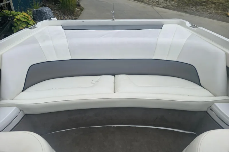 Slide: The Image of Interior seating of a 2001 Cobalt 232 boat with white and gray upholstery. - 14