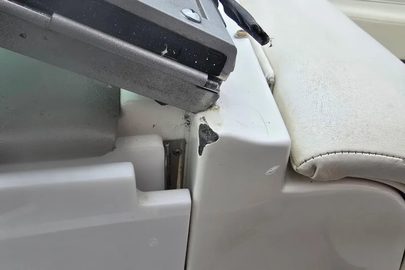 Slide: The Image of Damaged area on a 2001 Cobalt 232 boat interior, showing wear and tear. - 21