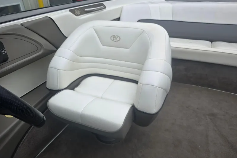 Slide: The Image of White leather seat in a 2001 Cobalt 232 boat interior. - 8