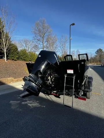 Slide: The Image of 2024 Crestliner 2050 Commander boat with outboard motor on a sunny day. - 3