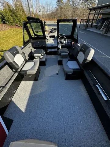 Slide: The Image of 2024 Crestliner 2050 Commander boat interior with spacious seating and modern design. - 4