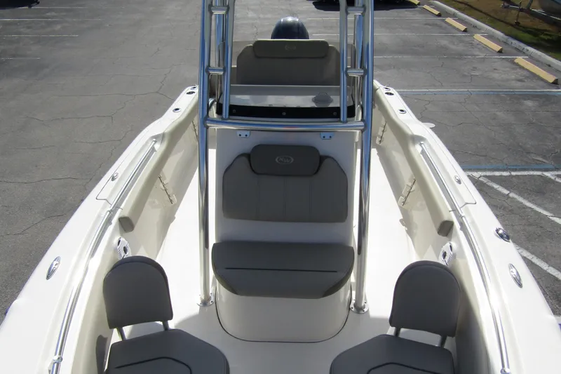 Slide: The Image of 2022 Key West 219 FS boat interior with seating and console view. - 11