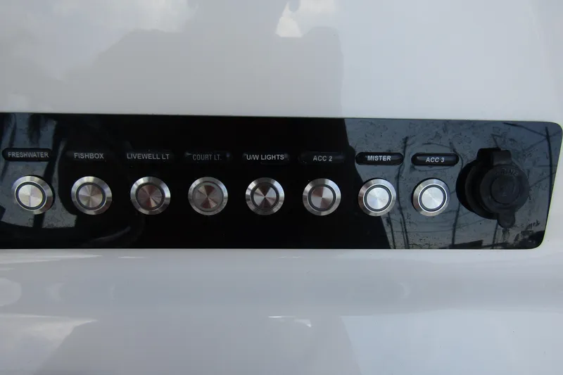Slide: The Image of Control panel of 2022 Key West 219 FS boat with labeled buttons and switches. - 23