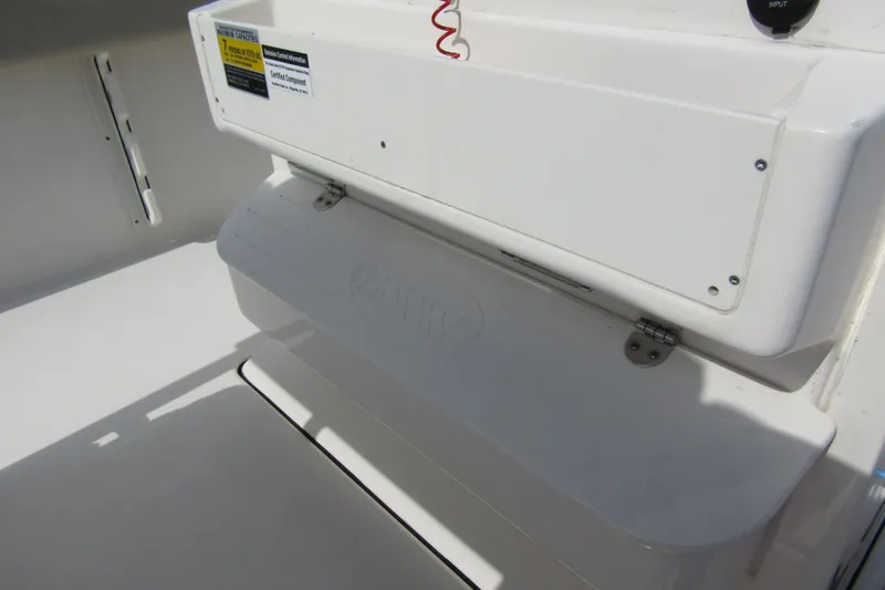 Slide: The Image of 2022 Key West 219 FS boat interior detail with storage compartment. - 27