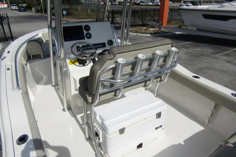 Slide: The Image of 2022 Key West 219 FS boat interior with helm, seating, and rod holders. - 38