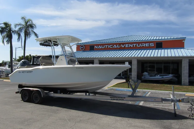 Slide: The Image of 2022 Key West 219 FS boat on trailer outside Nautical Ventures dealership. - 4