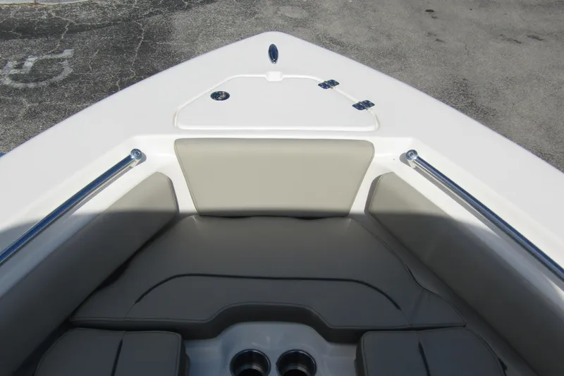 Slide: The Image of 2022 Key West 219 FS boat bow with cushioned seating and storage compartment. - 7