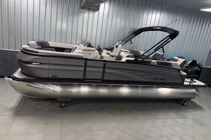The Image of 2026 Sylvan L3 SLZ Platinum pontoon boat in showroom, sleek design, modern features. - 0