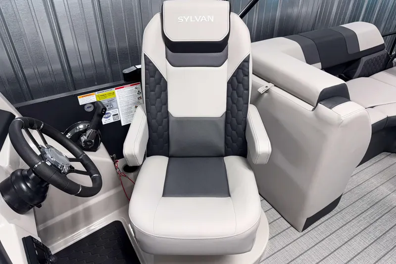 Slide: The Image of 2026 Sylvan L3 SLZ Platinum boat interior with steering wheel and seating. - 11
