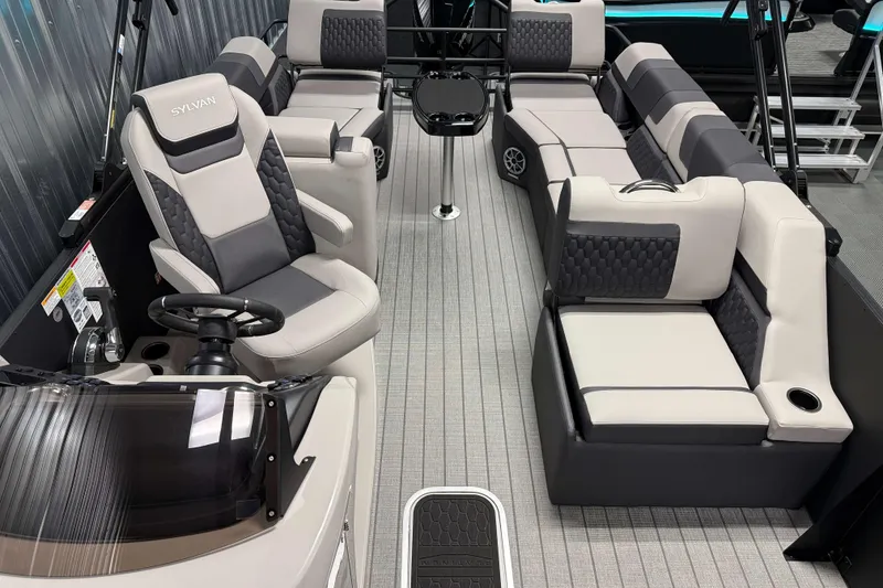 Slide: The Image of 2026 Sylvan L3 SLZ Platinum pontoon boat interior with luxurious seating and modern design. - 18