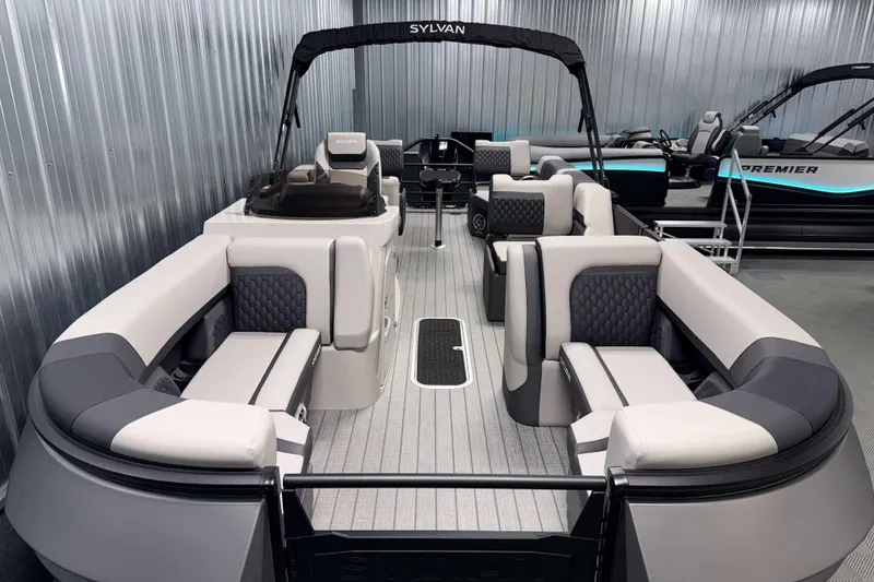 Slide: The Image of 2026 Sylvan L3 SLZ Platinum pontoon boat with luxurious seating and modern design. - 2