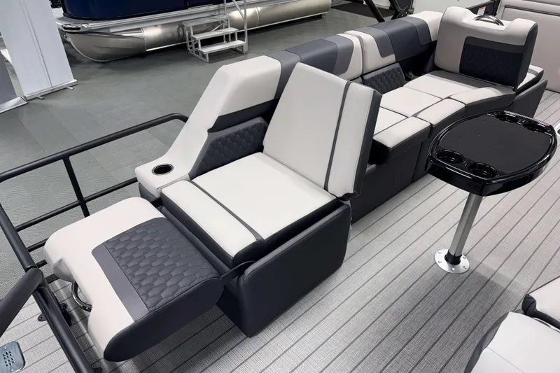 Slide: The Image of Luxurious seating on 2026 Sylvan L3 SLZ Platinum pontoon boat with sleek design and cup holders. - 24