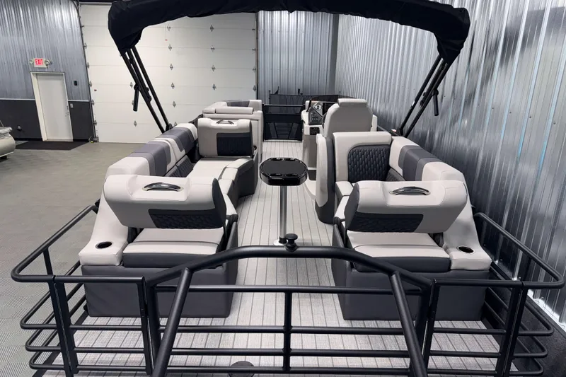 Slide: The Image of 2026 Sylvan L3 SLZ Platinum pontoon boat interior with luxurious seating and modern design. - 28