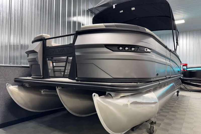 Slide: The Image of 2026 Sylvan L3 SLZ Platinum pontoon boat in showroom, sleek design, metallic finish. - 30