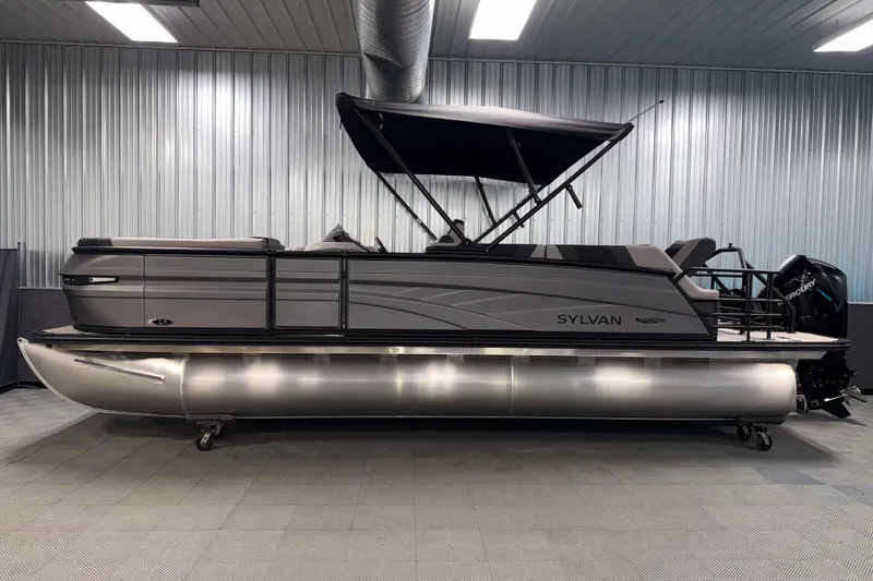 Slide: The Image of 2026 Sylvan L3 SLZ Platinum pontoon boat in a showroom with metallic finish. - 32