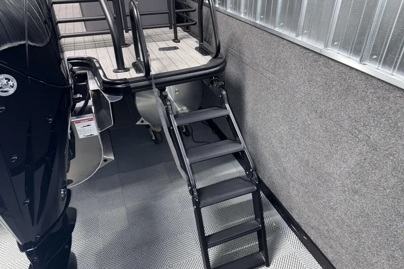 Slide: The Image of 2026 Sylvan L3 SLZ Platinum boat with rear ladder and engine detail. - 35