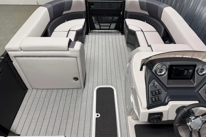 Slide: The Image of 2026 Sylvan L3 SLZ Platinum boat interior with luxurious seating and modern dashboard. - 6