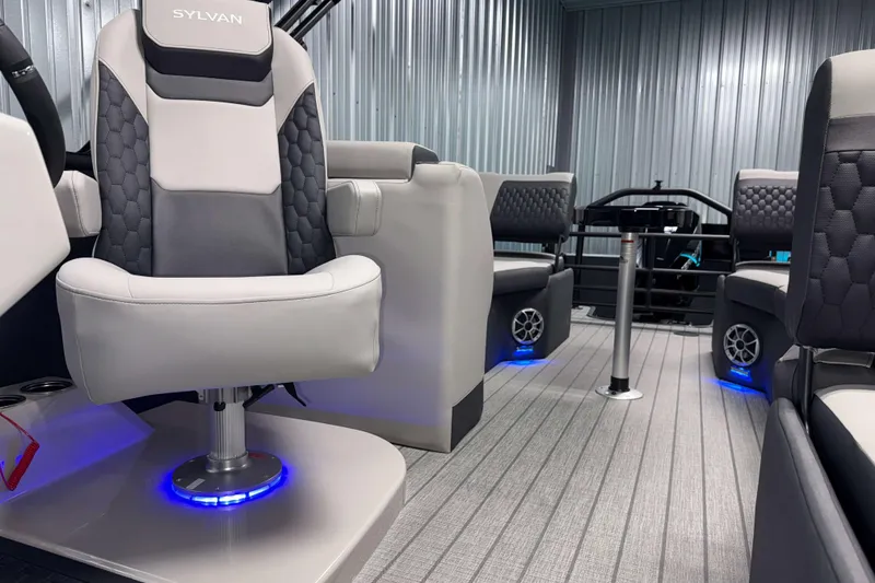 Slide: The Image of Luxurious interior of 2026 Sylvan L3 SLZ Platinum boat with modern seating and ambient lighting. - 9