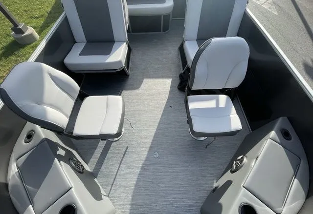 Slide: The Image of 2024 Godfrey Pontoons Mighty G 1476 F interior with seating and storage compartments. - 3