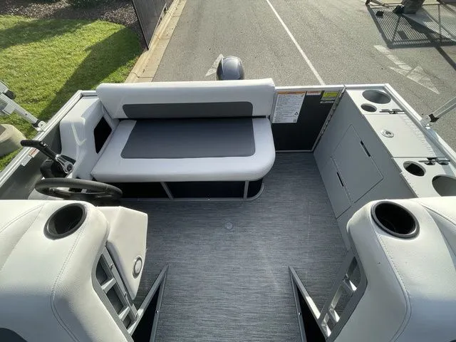 Slide: The Image of 2024 Godfrey Pontoons Mighty G 1476 F interior with seating and steering wheel. - 5