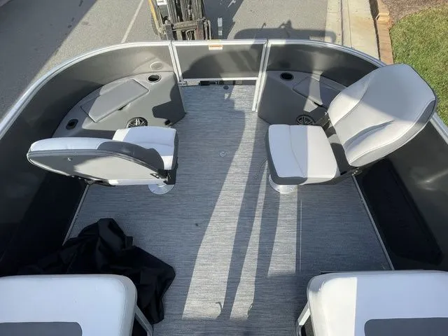 Slide: The Image of 2024 Godfrey Pontoons Mighty G 1476 F interior with seating and storage compartments. - 8