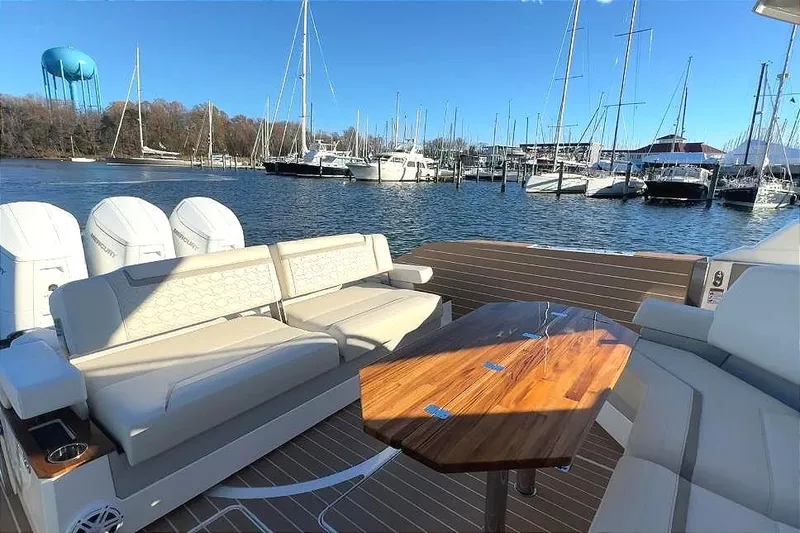 Slide: The Image of 2024 Tiara Yachts 48 LS in harbor with luxurious deck. - 20