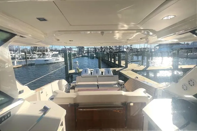 Slide: The Image of Interior view of 2024 Tiara Yachts 48 LS at the marina. - 25