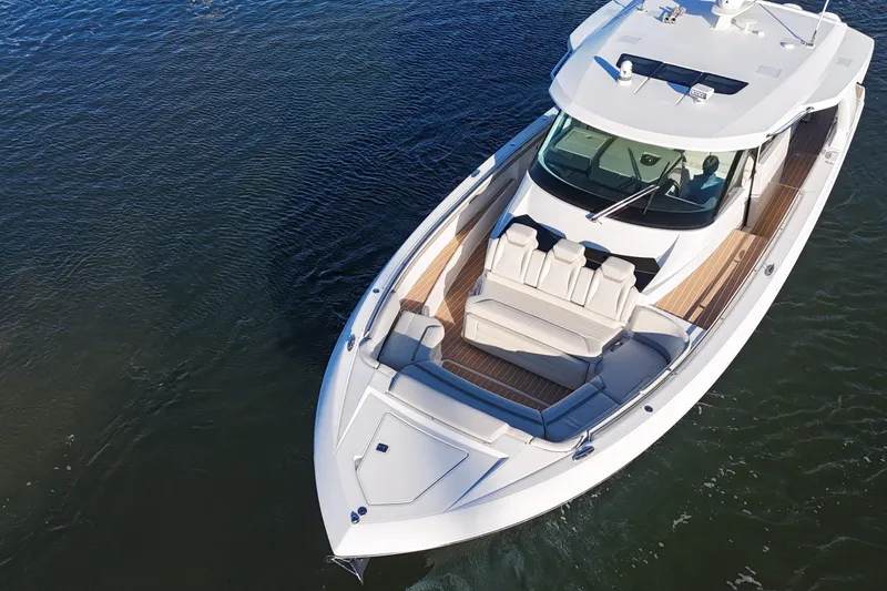 Slide: The Image of 2024 Tiara Yachts 48 LS luxury boat on calm water, aerial view. - 3