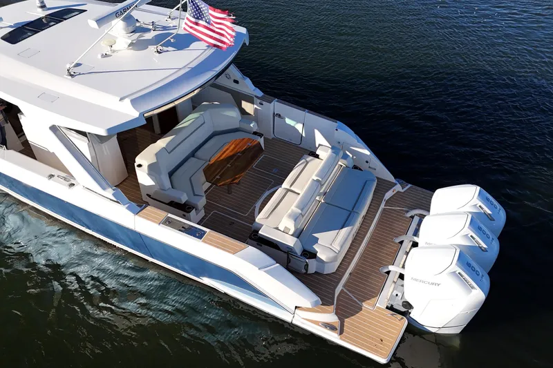 Slide: The Image of 2024 Tiara Yachts 48 LS on water with luxurious deck. - 4