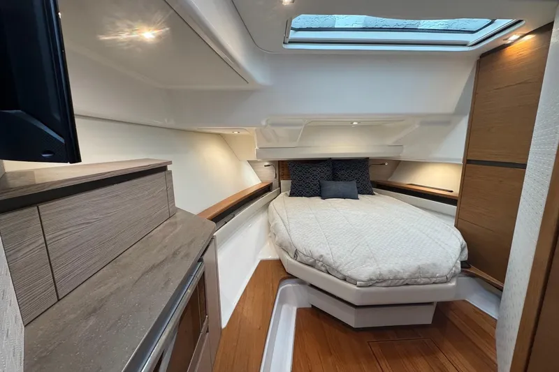 Slide: The Image of Luxurious cabin of 2024 Tiara Yachts 48 LS with skylight. - 6